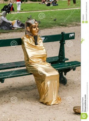 egyptian-mummy-living-statue-street-artist-doing-pharaoh-sitting-bench-36993641.jpg